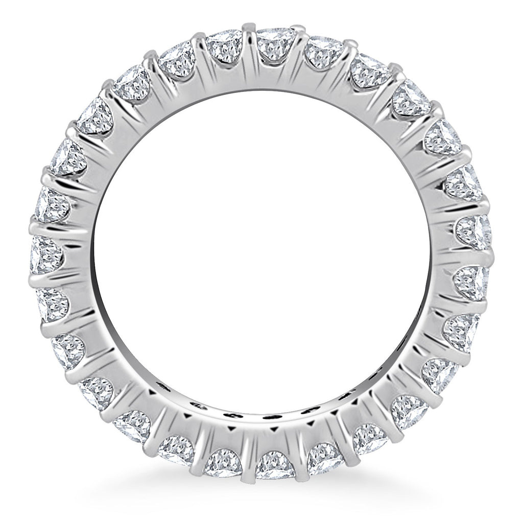Elegant 14k white gold eternity ring featuring prong-set round diamonds for timeless luxury and sophistication.