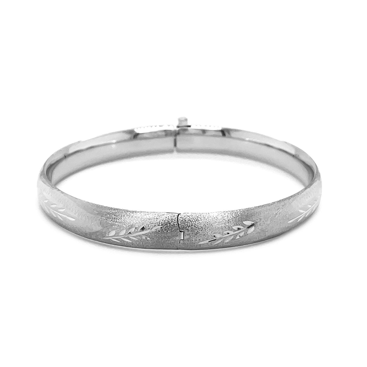 Classic floral carved bangle in 14k white gold, showcasing intricate detailing and timeless elegance.