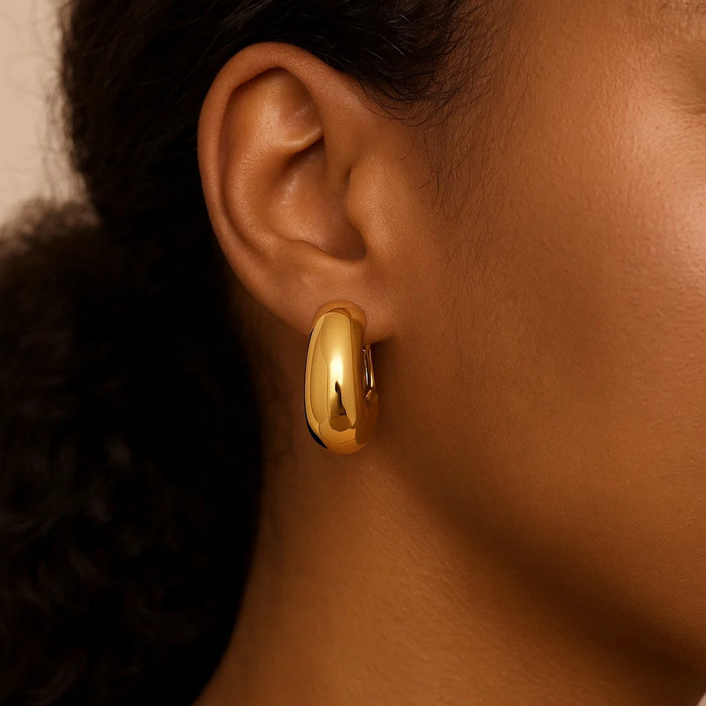 14k yellow gold textured fancy hoop earrings showcasing modern elegance and luxurious craftsmanship.
