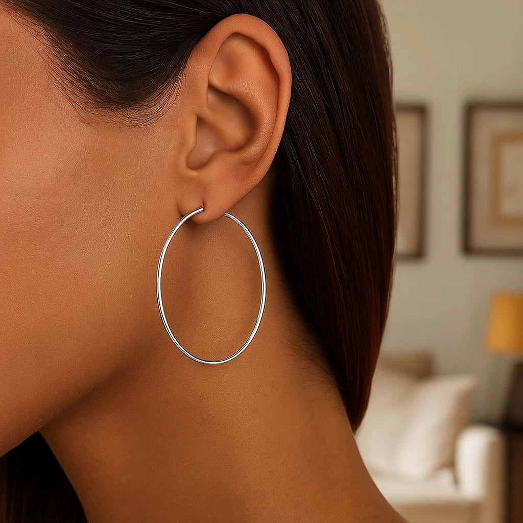 Polished 14k white gold hoop earrings with a sleek modern design, showcasing a timeless elegance for any occasion.