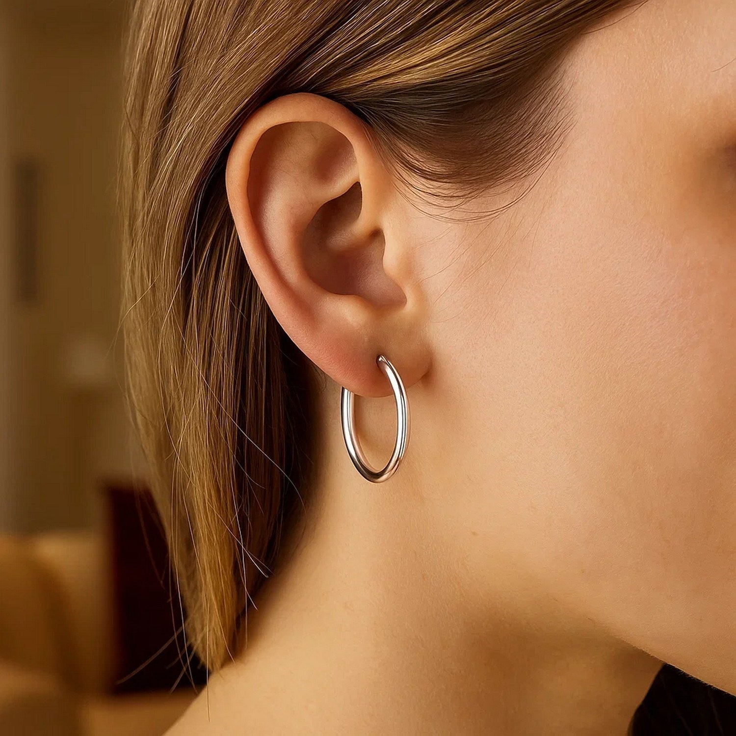 Elegant 14k white gold polished hoop earrings showcasing a timeless design, perfect for sophisticated occasions.