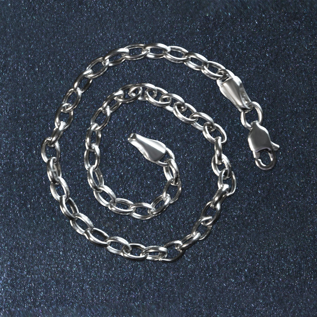 14k white gold oval rolo bracelet with modern link design, showcasing elegance and luxury in every detail.