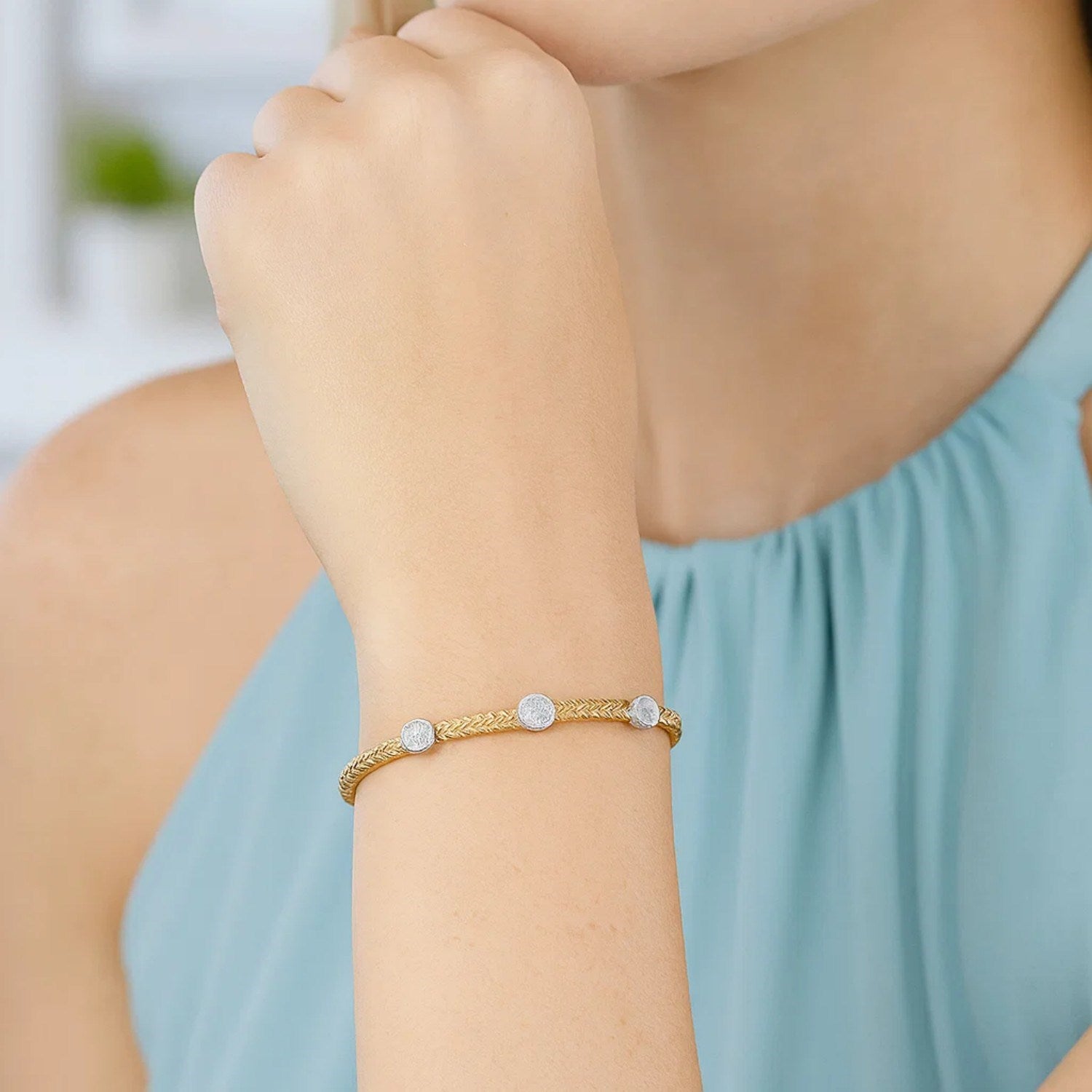 14k two-tone gold bracelet featuring diamond accents in a modern basket weave design, showcasing elegance and craftsmanship.