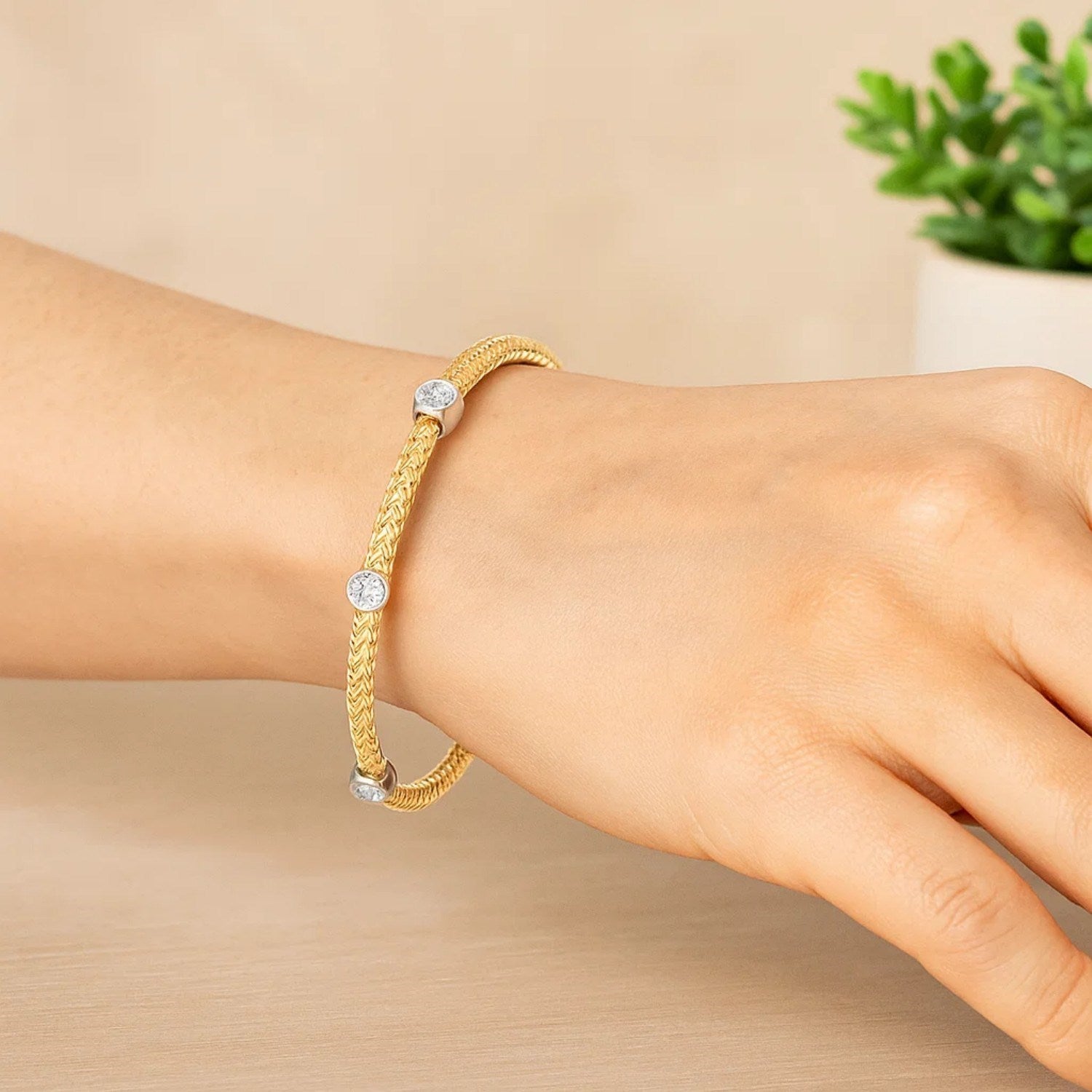 14k two-tone gold bracelet featuring diamond accents in a modern basket weave design, 3.80 mm width.