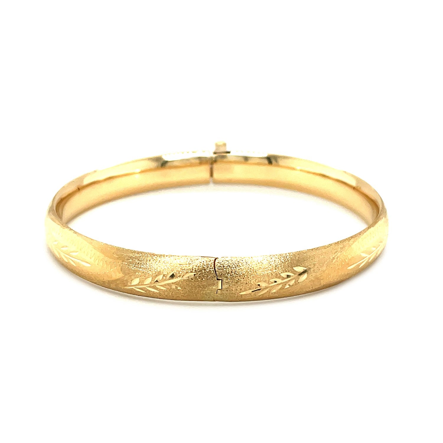 Classic floral carved bangle in 14k yellow gold, showcasing exquisite craftsmanship and timeless elegance.