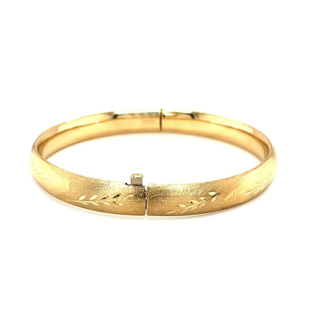 Classic floral carved bangle in 14k yellow gold, showcasing luxurious craftsmanship and timeless elegance.