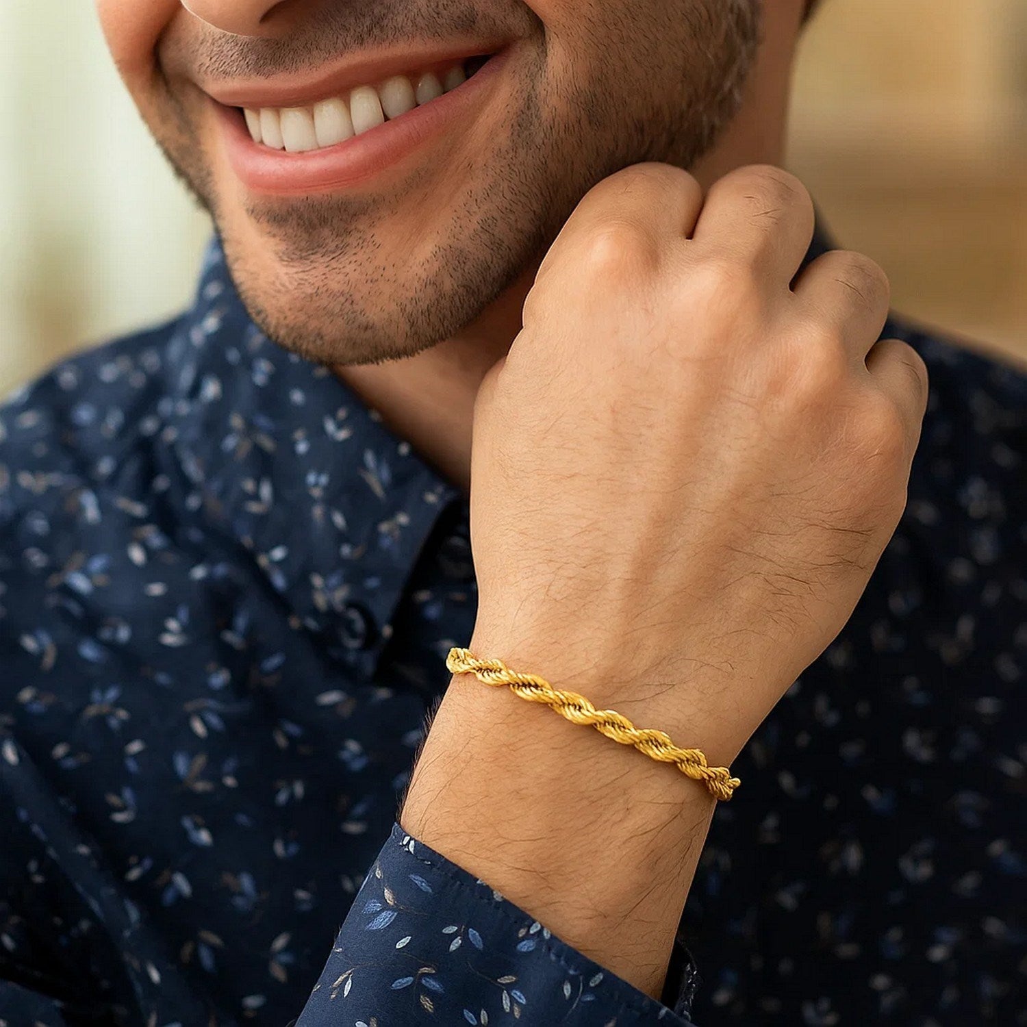 14k yellow gold diamond cut rope bracelet, 4.00 mm, showcasing elegant luxury and intricate craftsmanship.