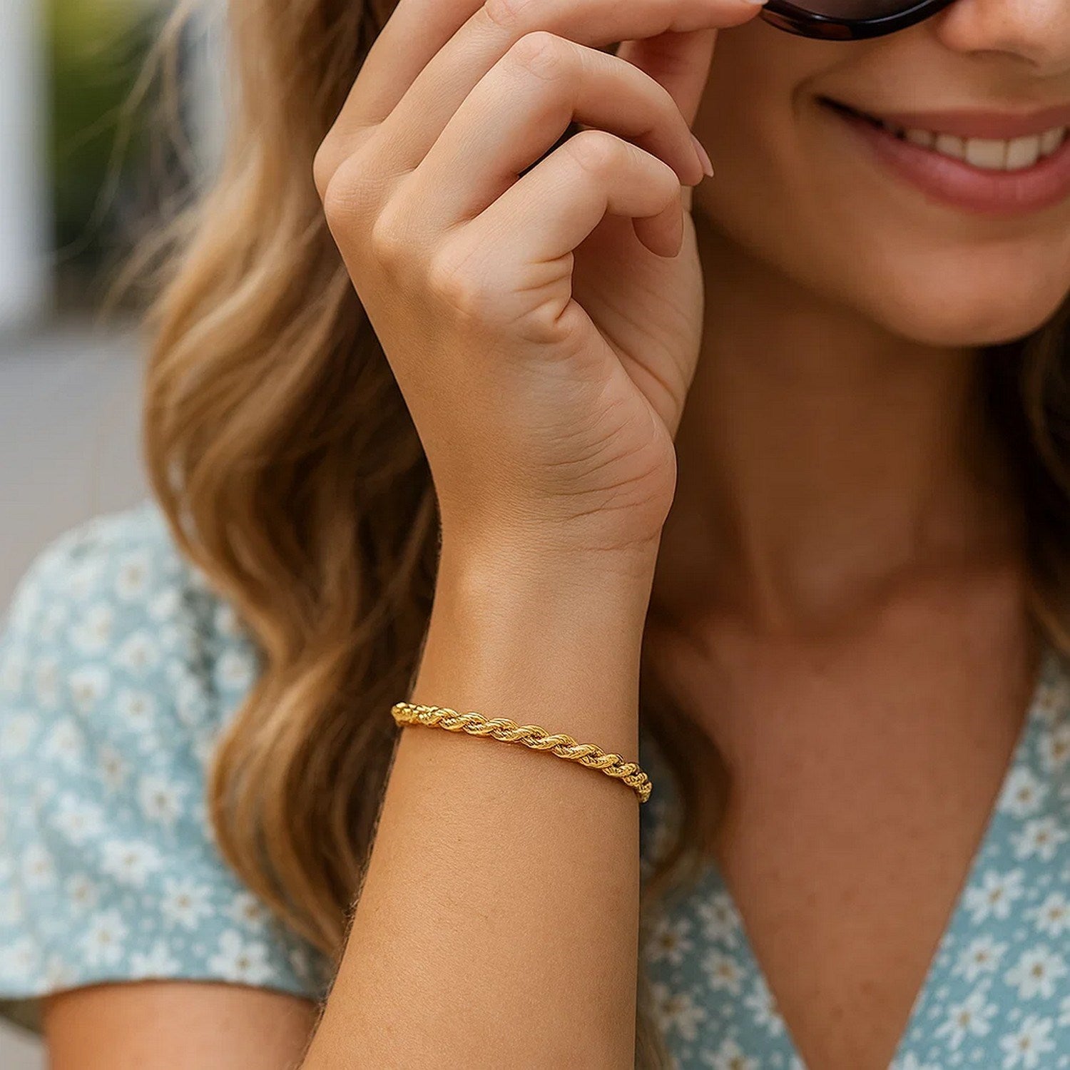 14k yellow gold diamond cut rope bracelet, 4.00 mm, showcasing elegant luxury and intricate craftsmanship.