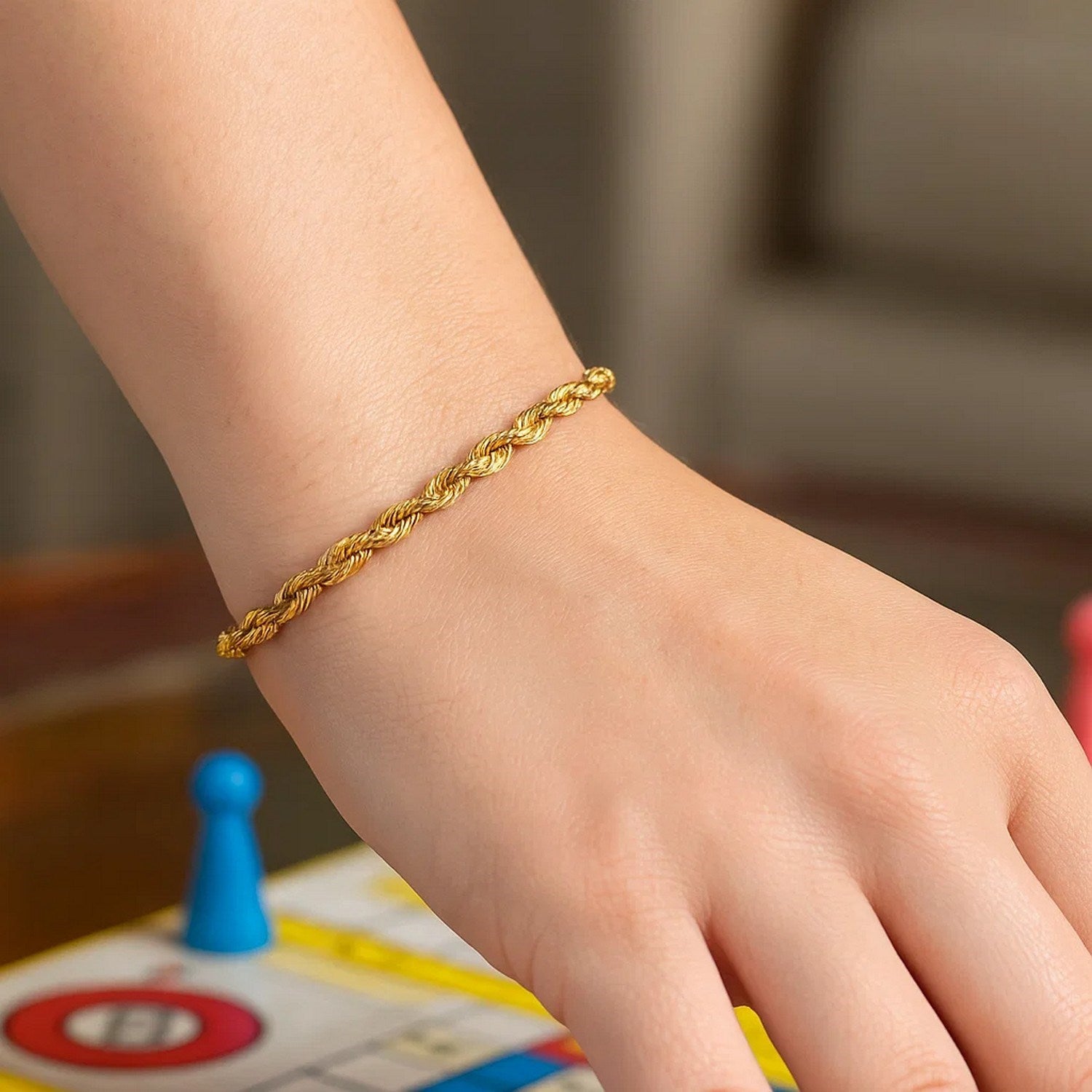 14k yellow gold diamond cut rope bracelet, 4.00 mm, showcasing elegant luxury and intricate craftsmanship.