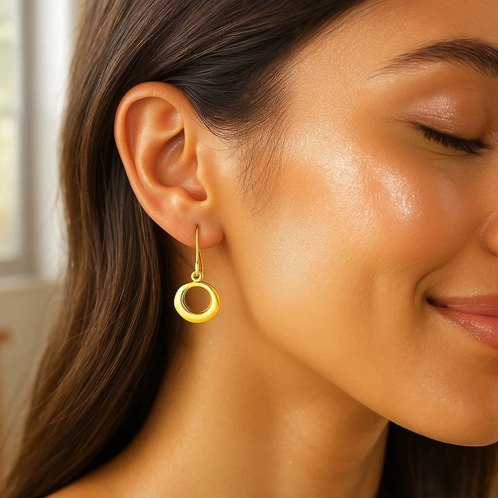 14k yellow gold modern open circle dangle earrings showcasing elegant movement and refined design.
