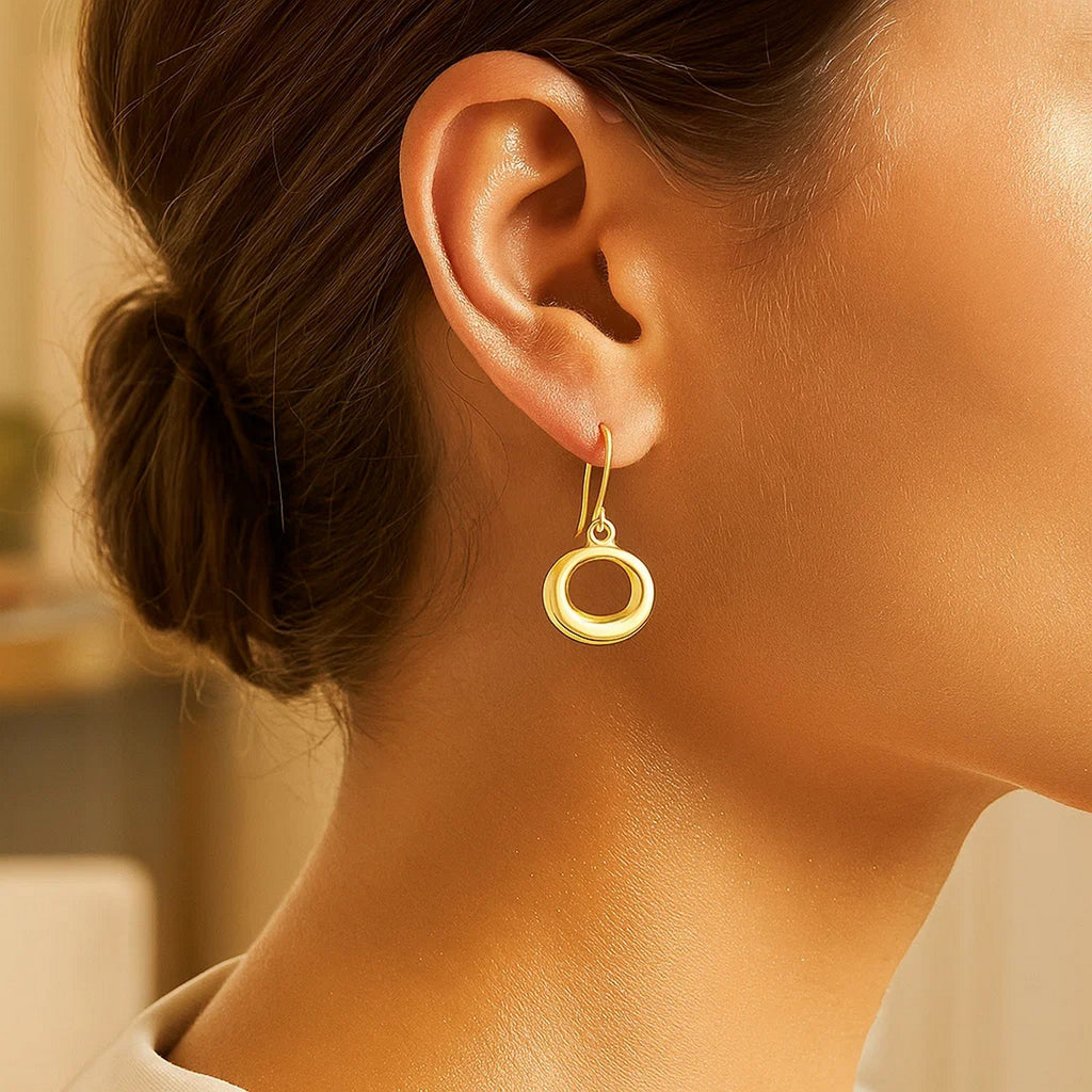 14k yellow gold modern open circle dangle earrings, showcasing elegant movement and timeless sophistication.