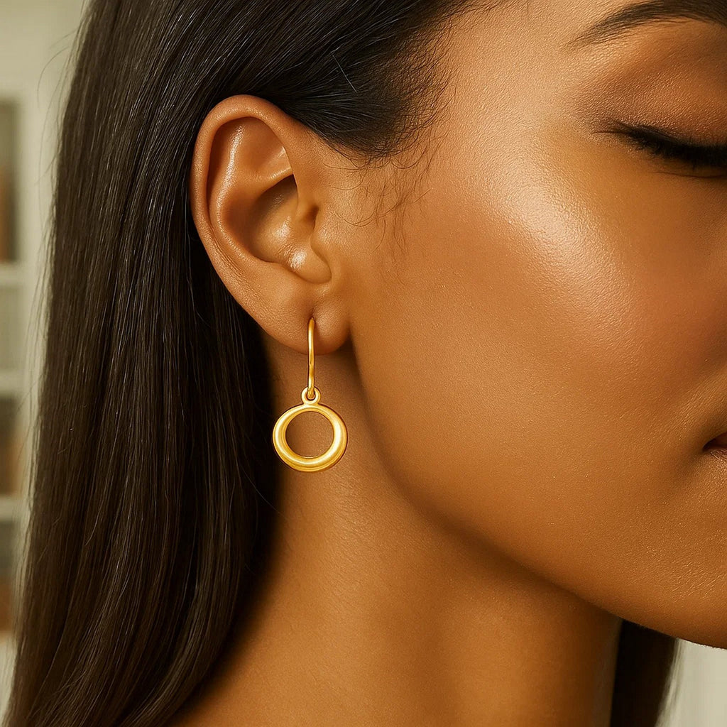 14k yellow gold modern open circle dangle earrings with elegant movement and timeless design.