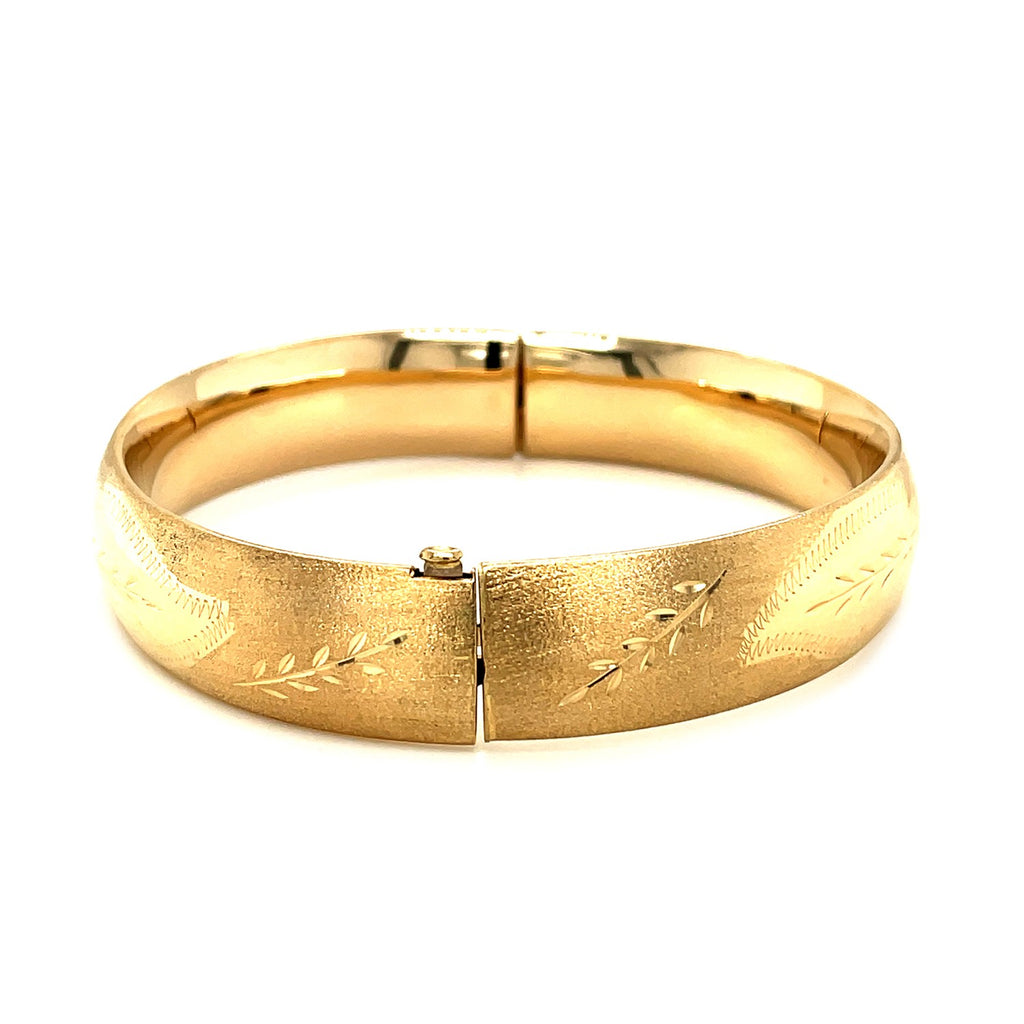 Classic floral carved bangle in 14k yellow gold, showcasing modern elegance with a refined stud design.