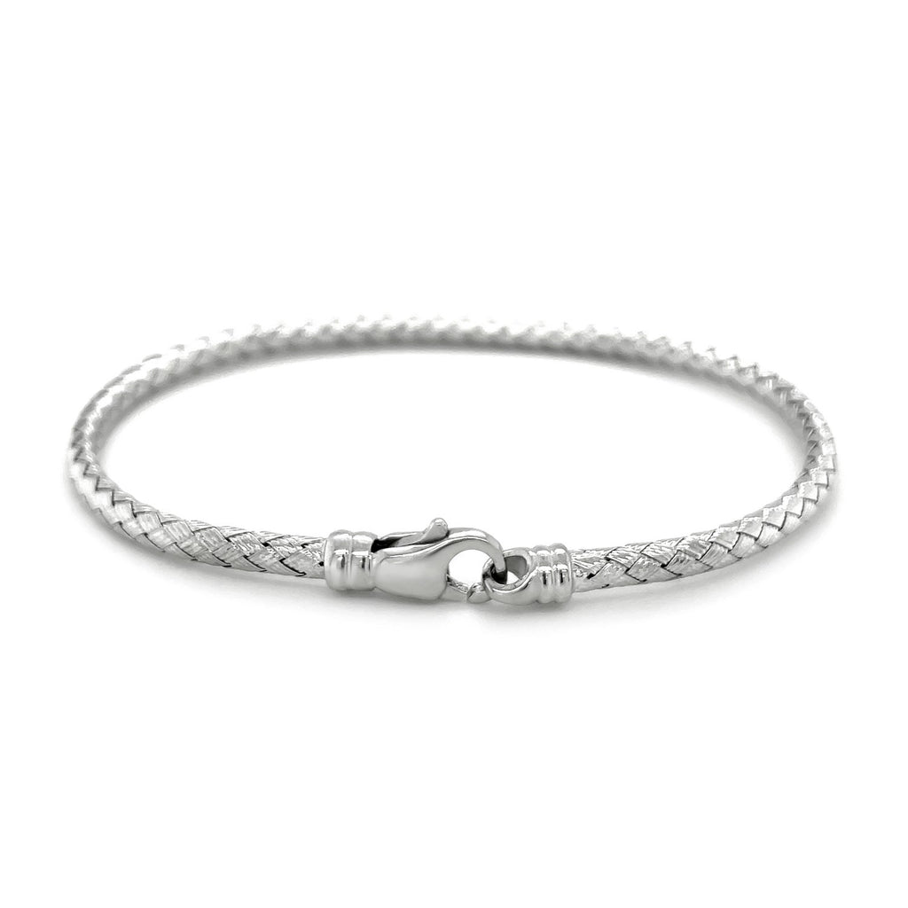 Fancy weave bangle in 14k white gold, showcasing a modern design with luxurious elegance and intricate craftsmanship.