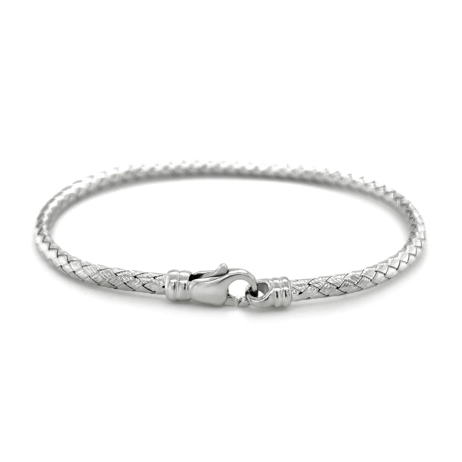 Fancy weave bangle in 14k white gold, showcasing a modern design with luxurious elegance and intricate craftsmanship.
