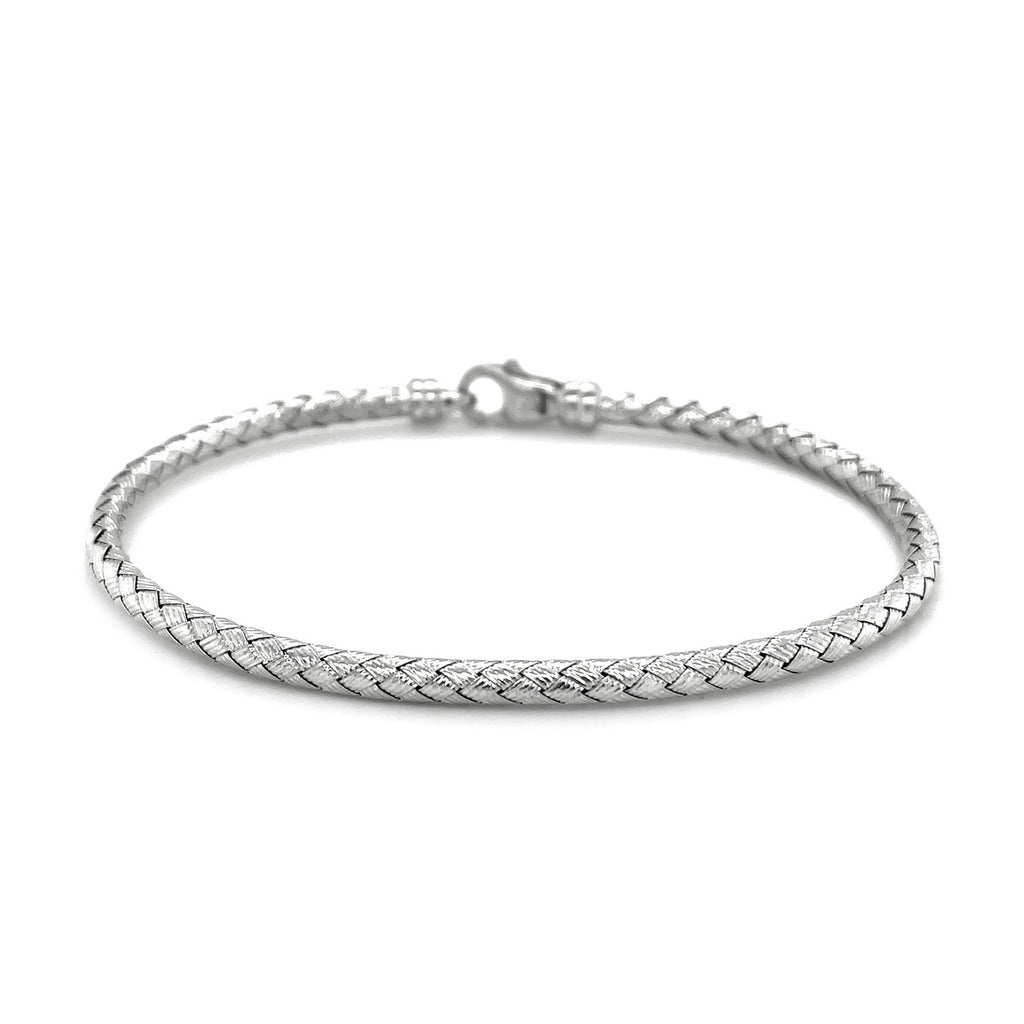 Fancy weave bangle in 14k white gold, showcasing modern elegance and luxurious craftsmanship.