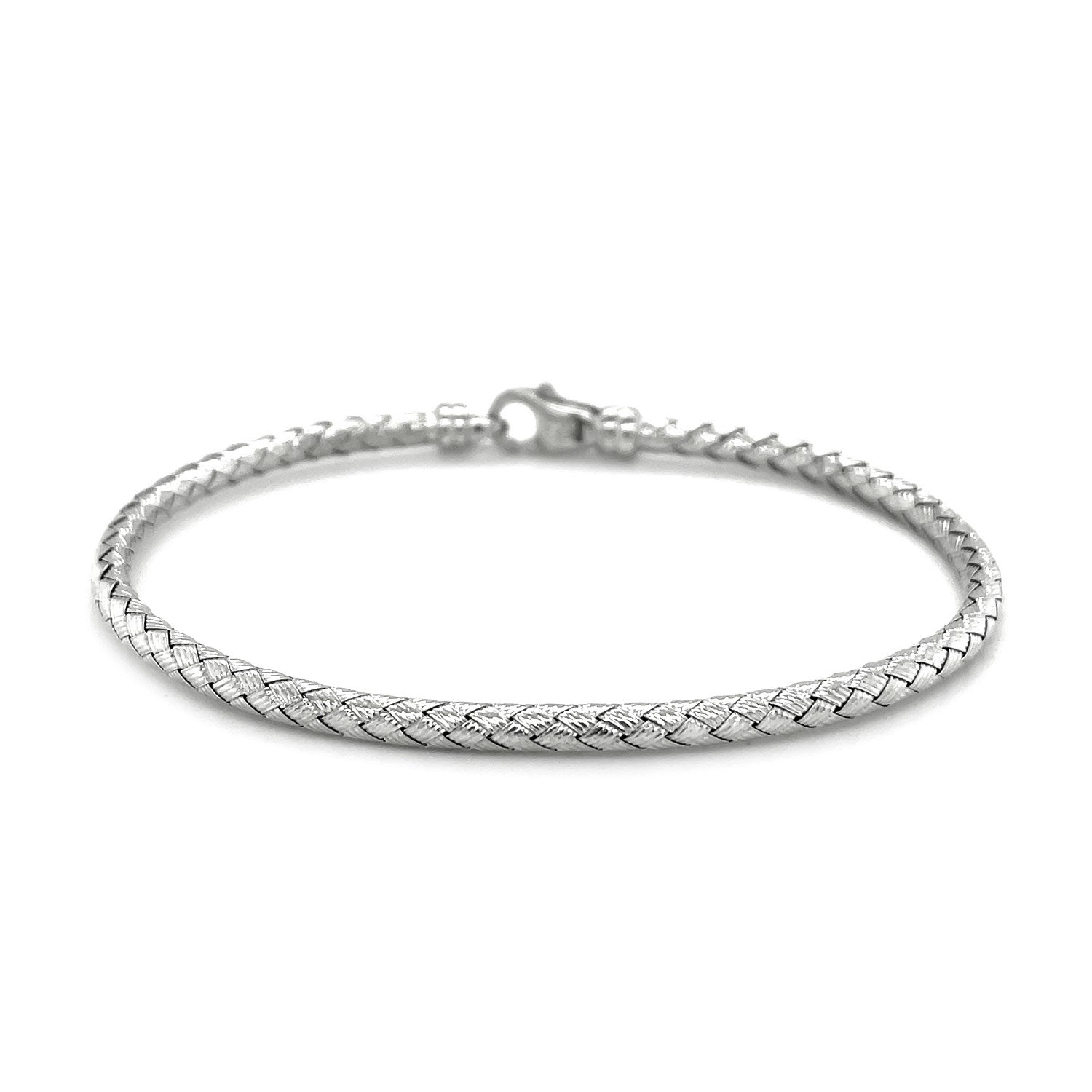Fancy weave bangle in 14k white gold, showcasing modern elegance and luxurious craftsmanship.