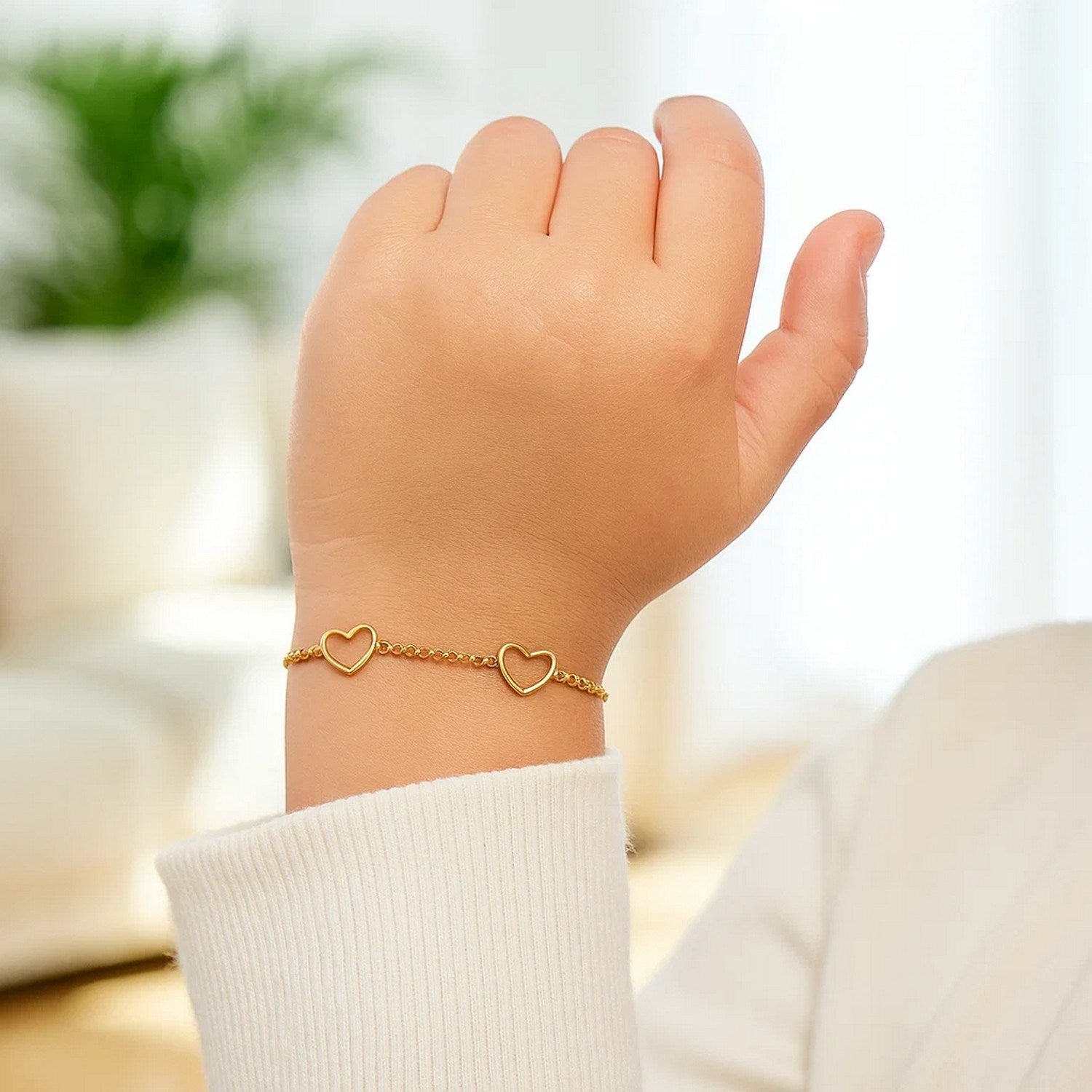 14k yellow gold children's bracelet featuring minimalist heart charms, perfect for elegant everyday wear.