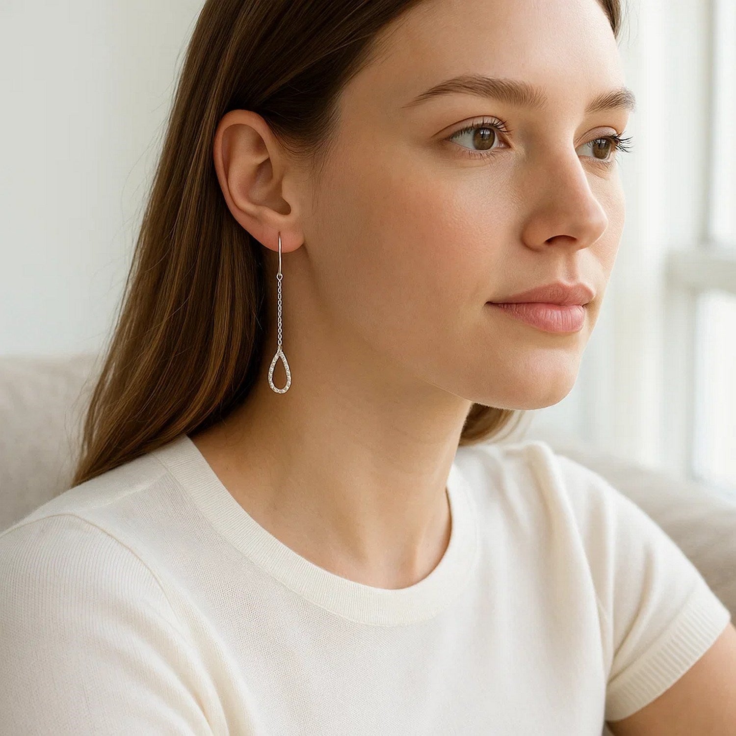14k white gold textured pear-shaped drop earrings with elegant chain design, perfect for sophisticated occasions.