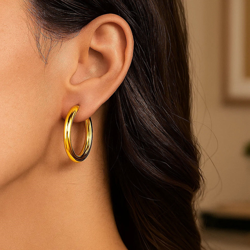 14k yellow gold polished hoop earrings, modern design, elegant shine, perfect for any luxury jewelry collection.