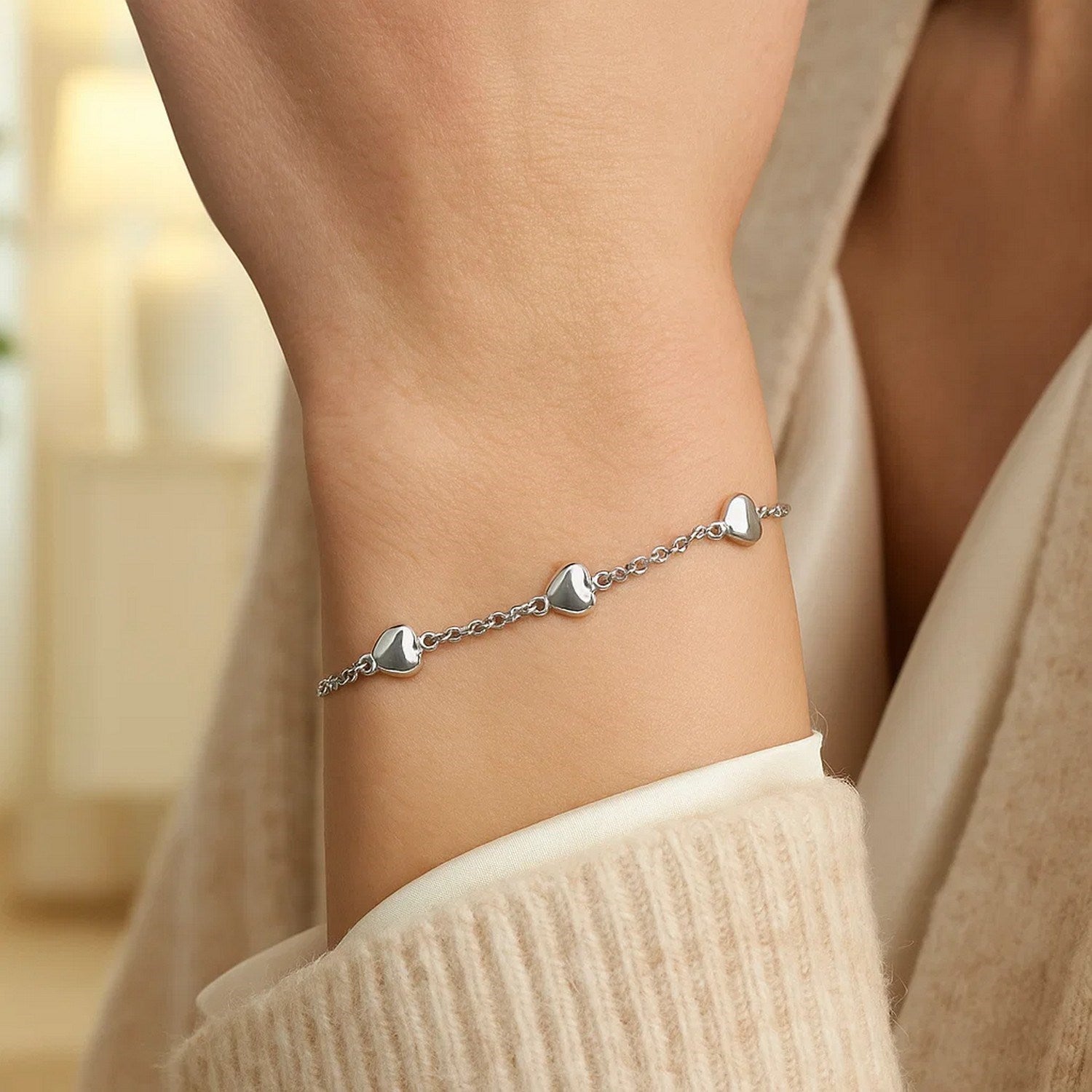 14k white gold rolo chain bracelet featuring elegant puffed heart stations, a timeless classic for luxury jewelry lovers.