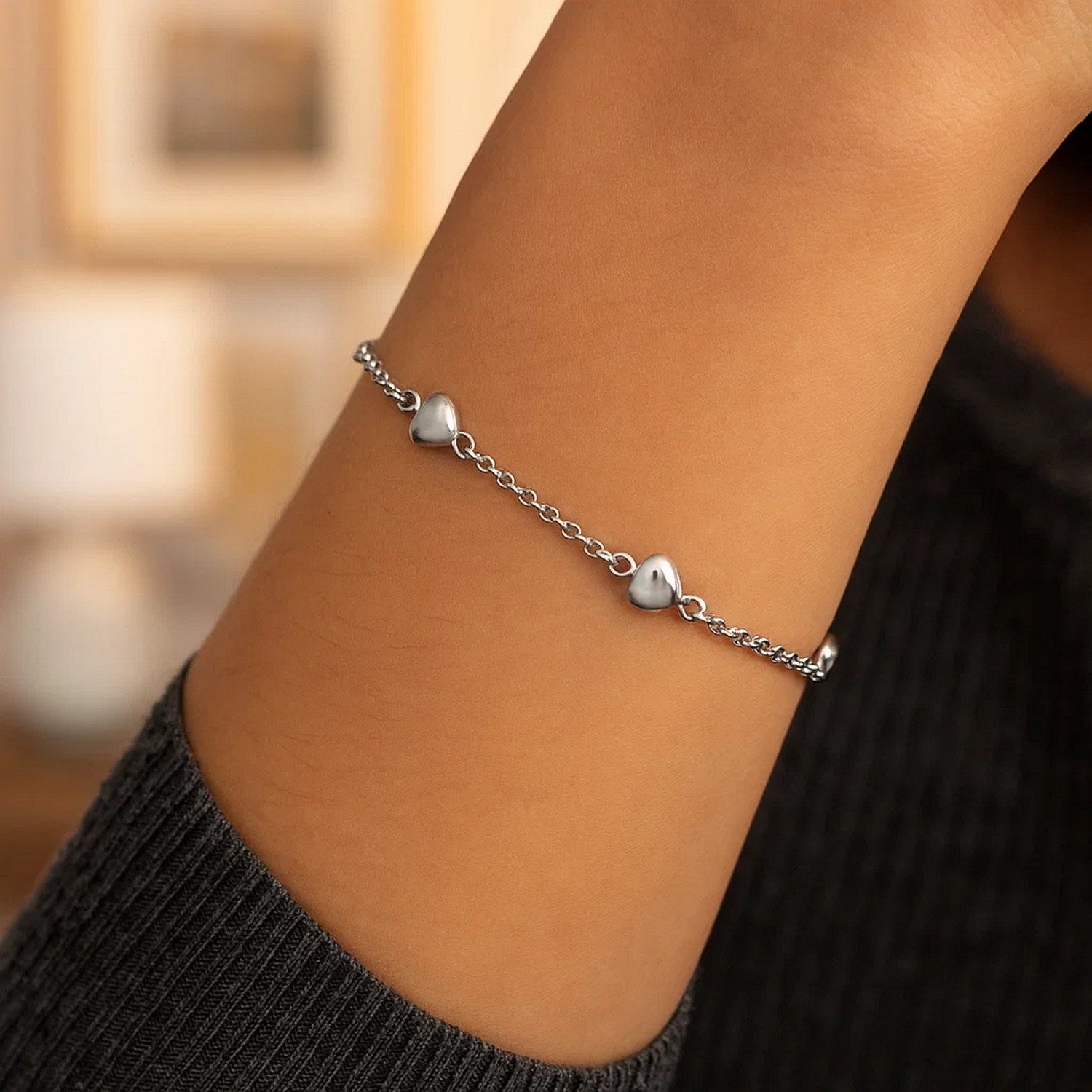 14k white gold rolo chain bracelet featuring elegant puffed heart stations in a classic design.