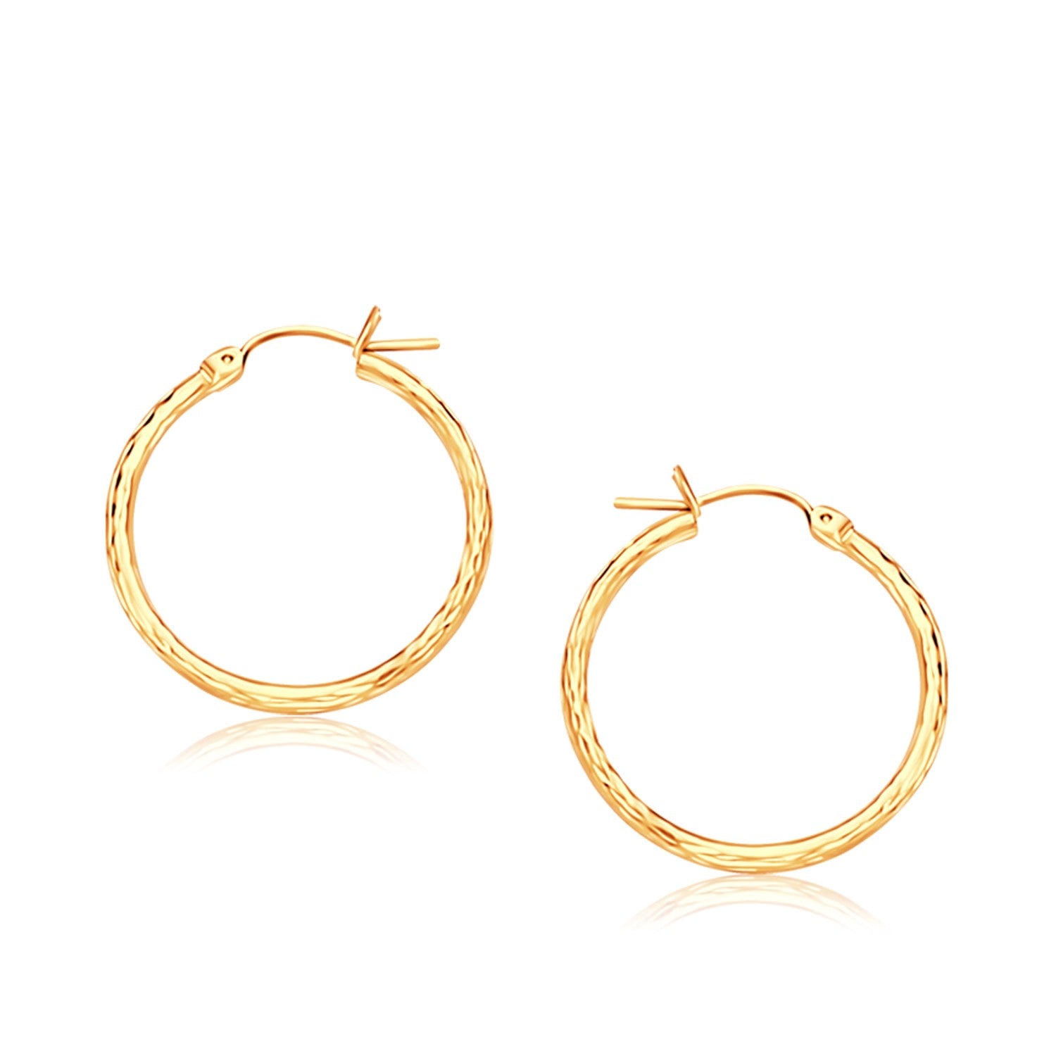 14k yellow gold slender hoop earrings with a diamond-cut finish, modern elegance for any luxury jewelry collection.