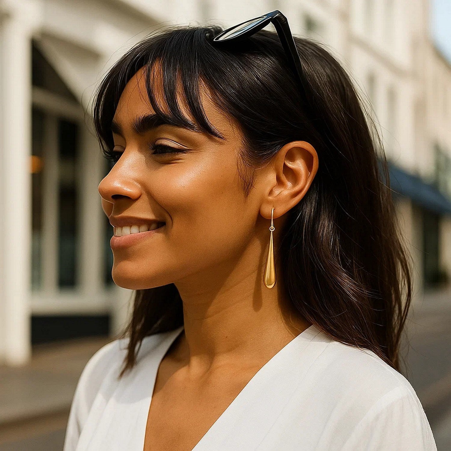 14k yellow gold minimalist drop earrings featuring a sleek, dramatic design for elegant sophistication.