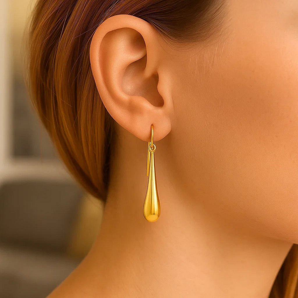 14k yellow gold minimalist drop earrings showcasing elegant design and refined craftsmanship.