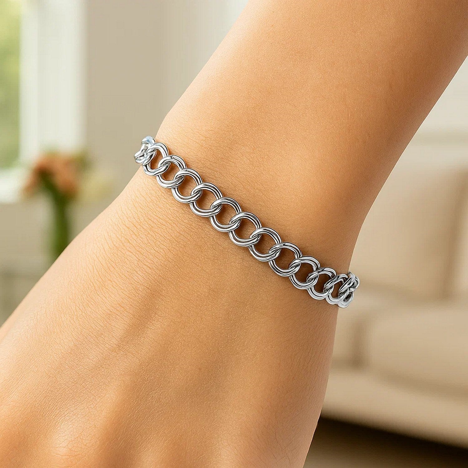 Elegant 14k white gold double link charm bracelet featuring a sleek design and polished finish, perfect for luxury styling.