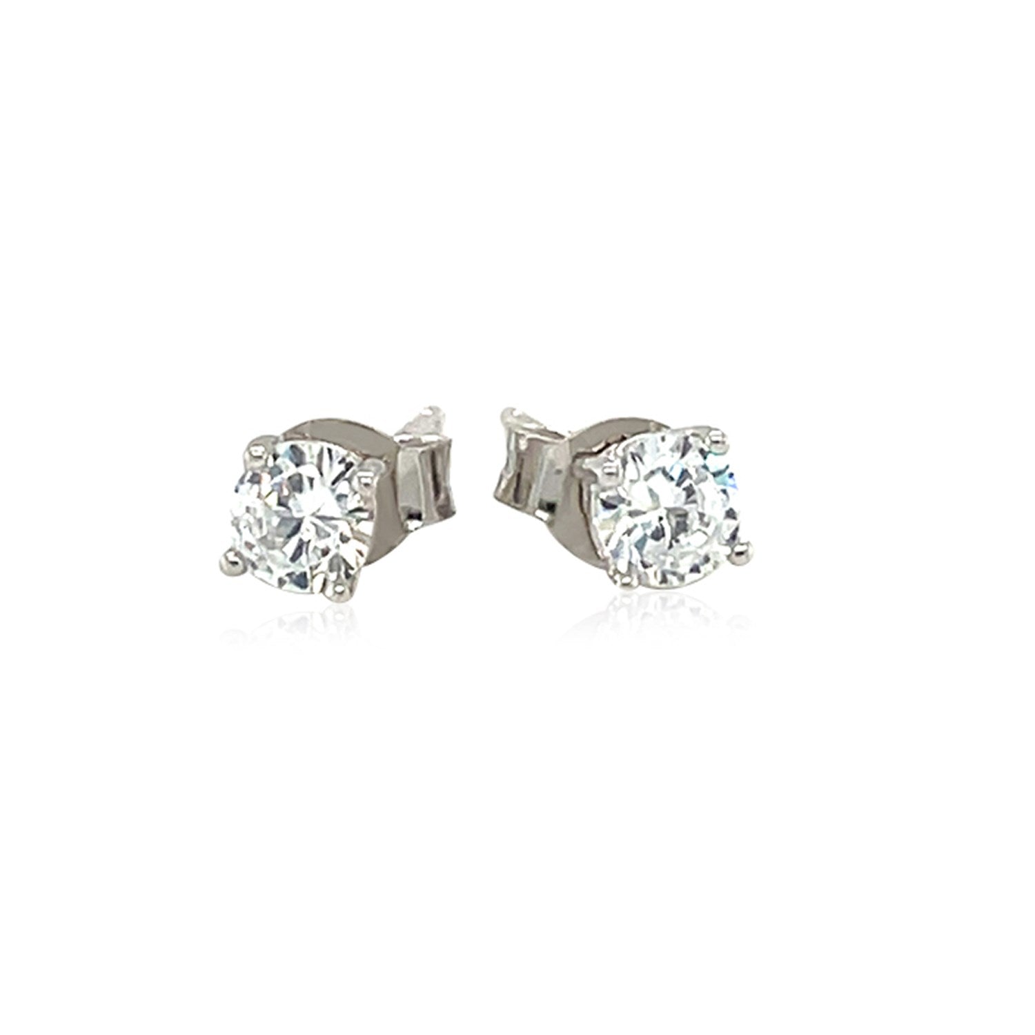 Sterling silver stud earrings featuring faceted white cubic zirconia in elegant prong settings for a modern touch.
