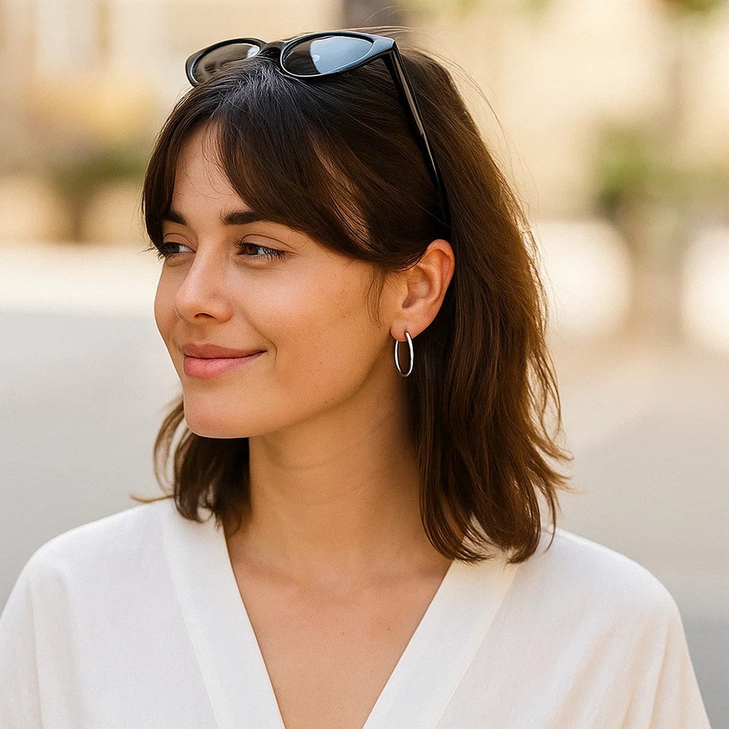 14k white gold polished hoop earrings showcasing a sleek, modern design for sophisticated elegance.