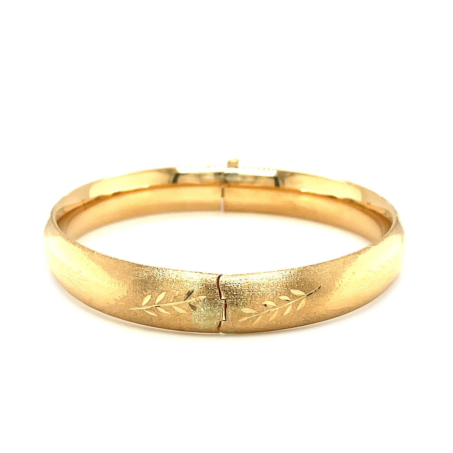 Classic floral carved bangle in 14k yellow gold, showcasing elegant design and luxurious craftsmanship.