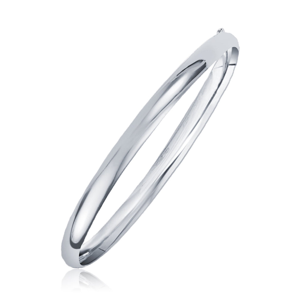 Classic 14k white gold bangle with modern stud design, elegantly crafted for timeless luxury.