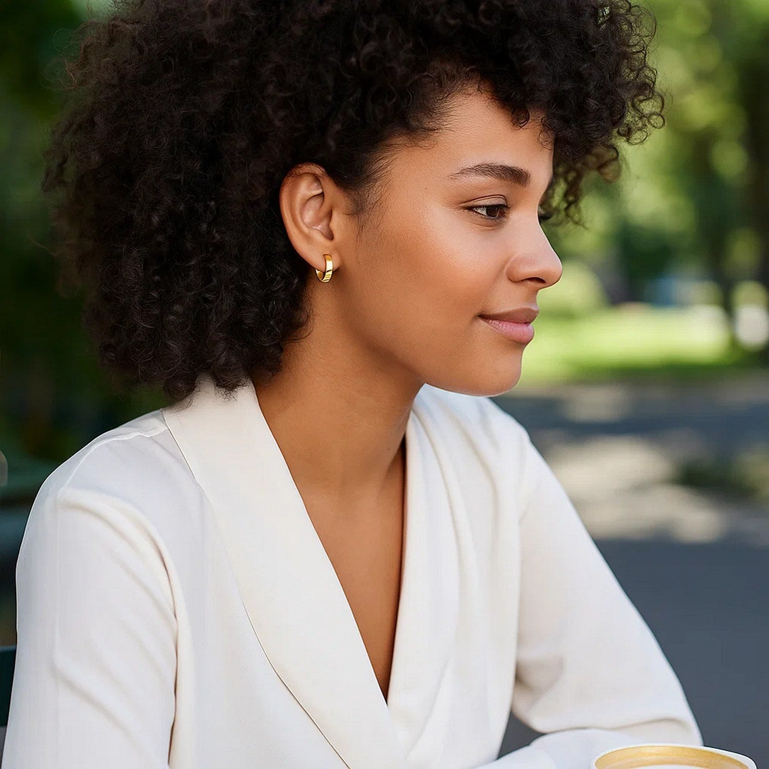 14k yellow gold modern small hoop earrings with a sleek flat design, perfect for elegant everyday wear.