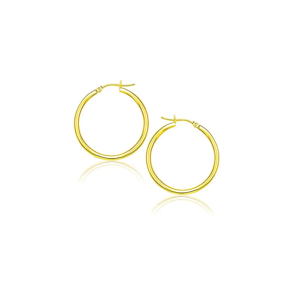 14k yellow gold polished hoop earrings with a modern design, perfect for elegant everyday wear.