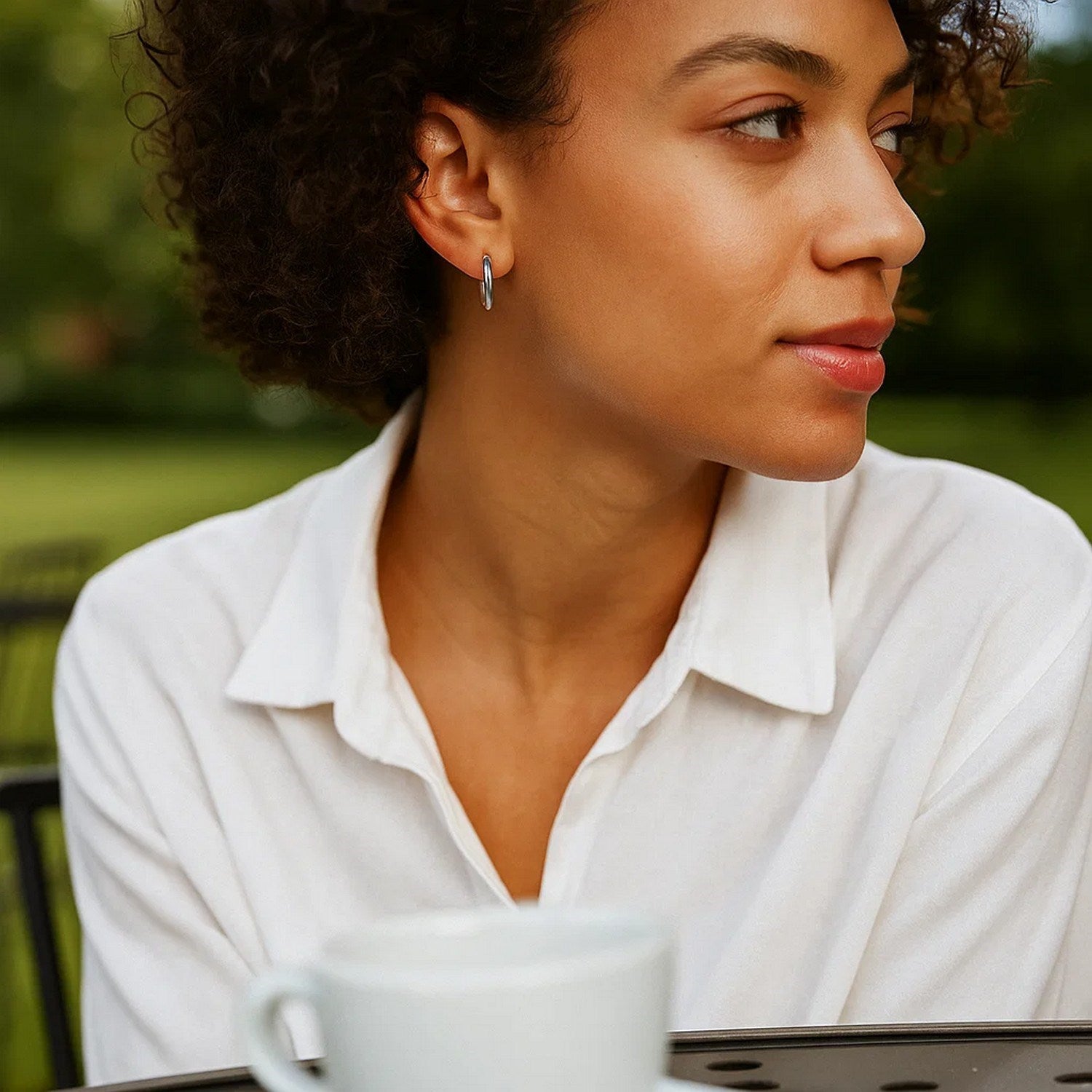 14k white gold polished hoop earrings with a sleek modern design, perfect for elegant everyday wear.