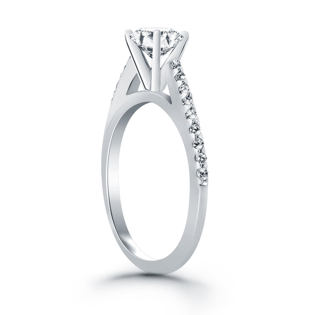 14k white gold micro prong diamond cathedral engagement ring showcasing a stunning round center stone in modern design.