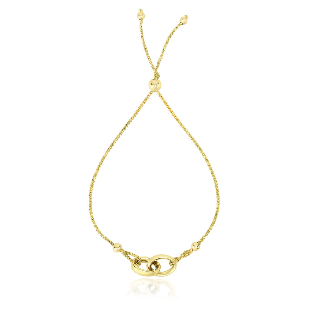 14k yellow gold adjustable lariat bracelet featuring entwined rings in a modern design, perfect for elegant layering.