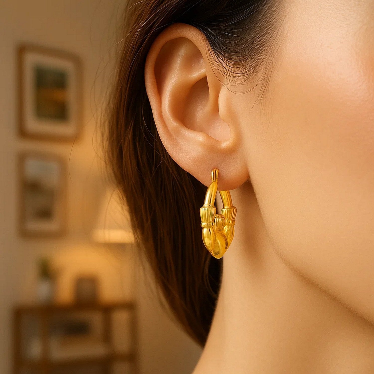 14k yellow gold modern Claddagh symbol hoop earrings showcasing elegant craftsmanship and timeless design.