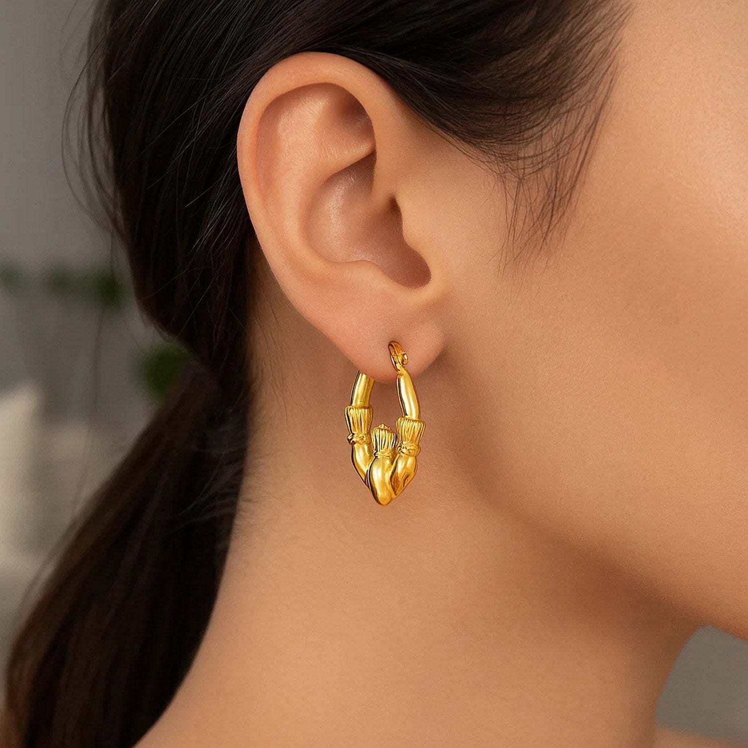 14k yellow gold modern Claddagh symbol hoop earrings showcasing elegance and timeless craftsmanship.