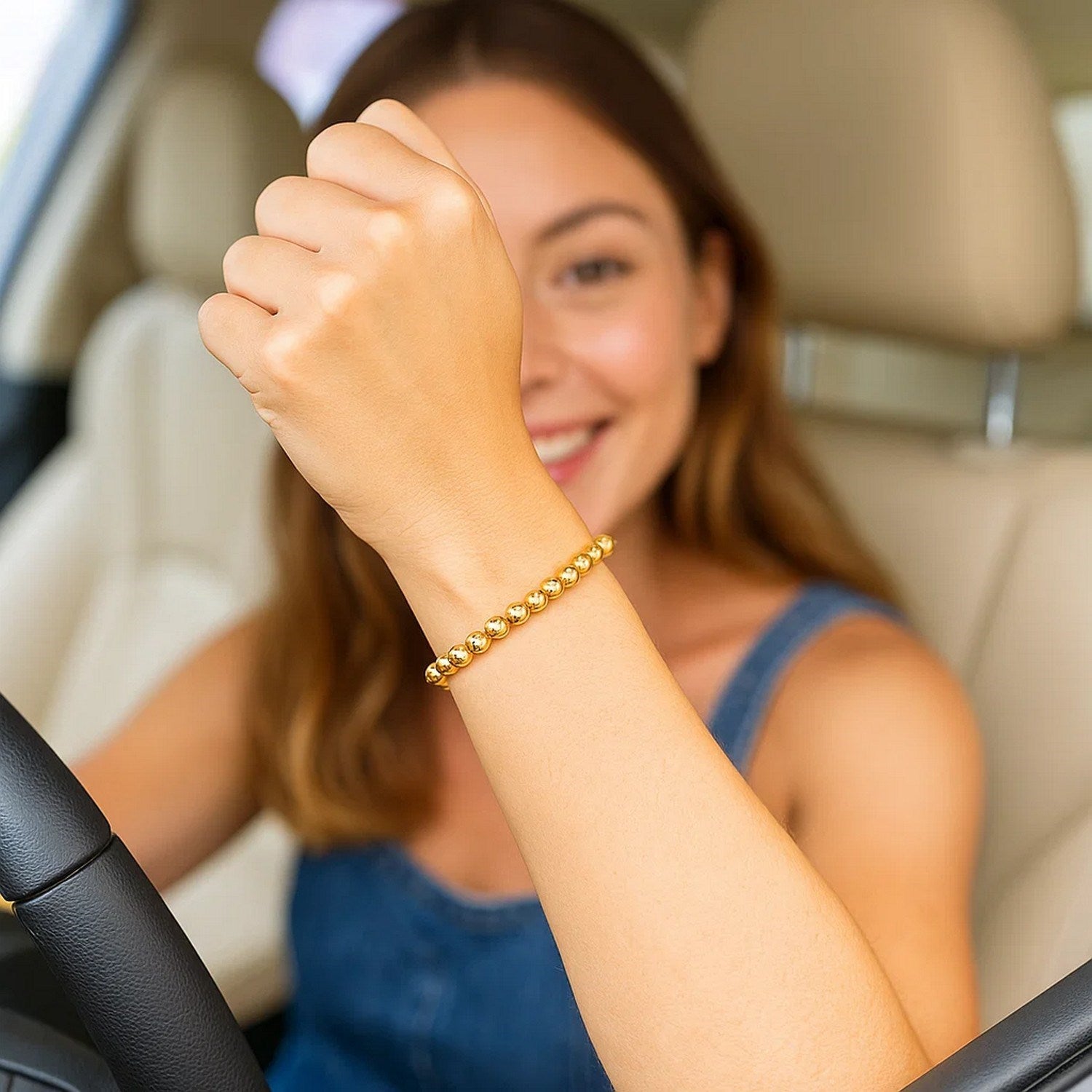14k yellow gold bead bracelet featuring a modern design with luxurious 5.00 mm beads for an elegant touch.