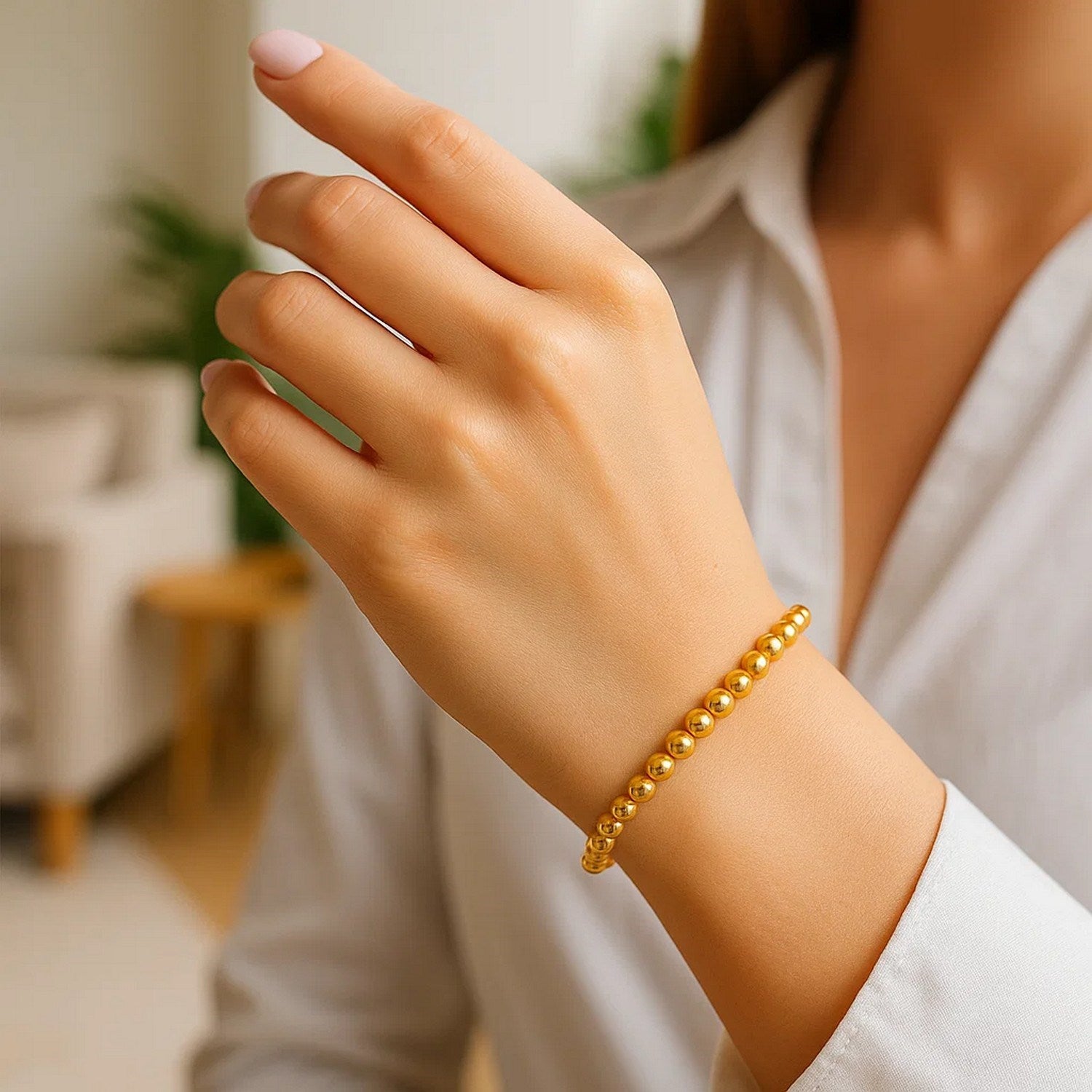 14k yellow gold bead bracelet with modern design, featuring 5.00 mm beads for a luxurious touch.