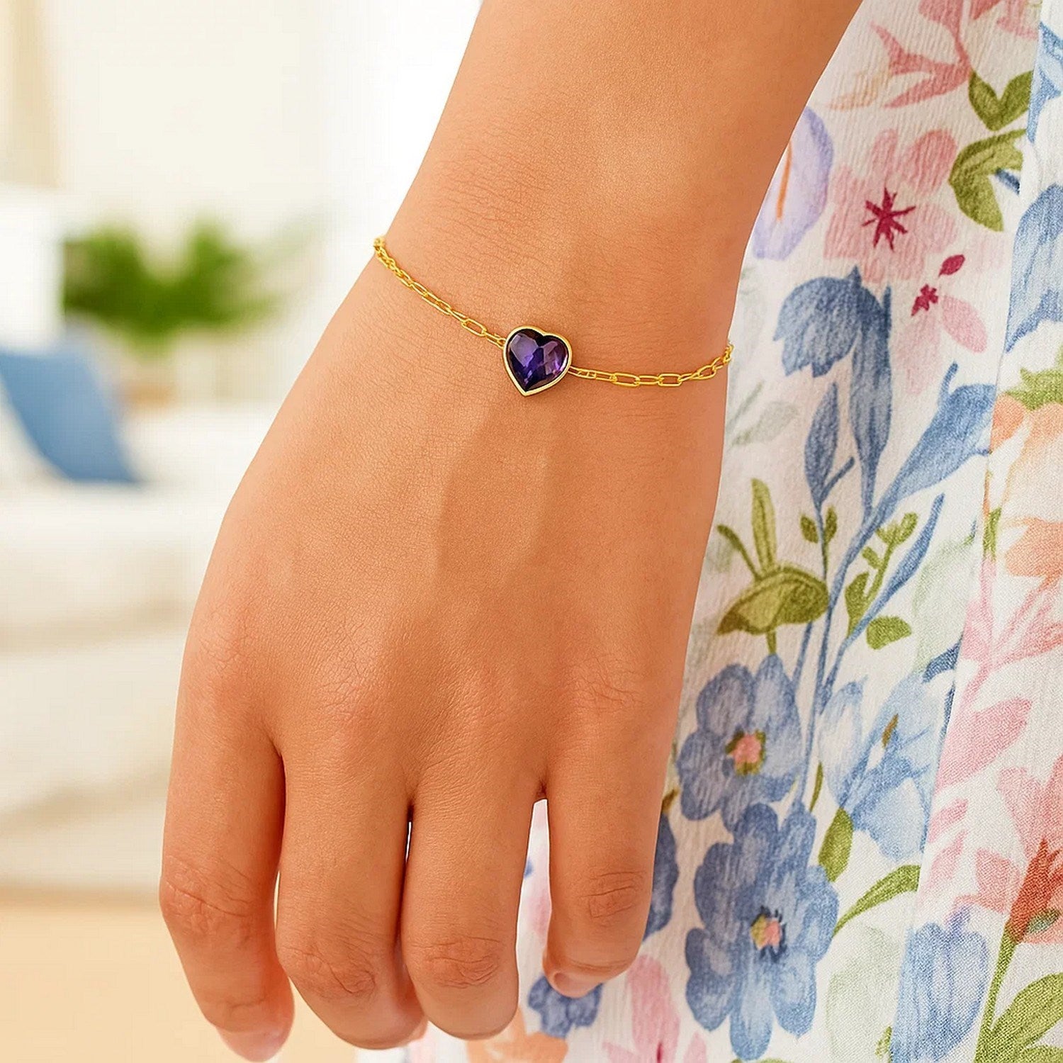 14K yellow gold amethyst heart bracelet featuring a minimalist design and elegant bezel setting on a delicate chain.