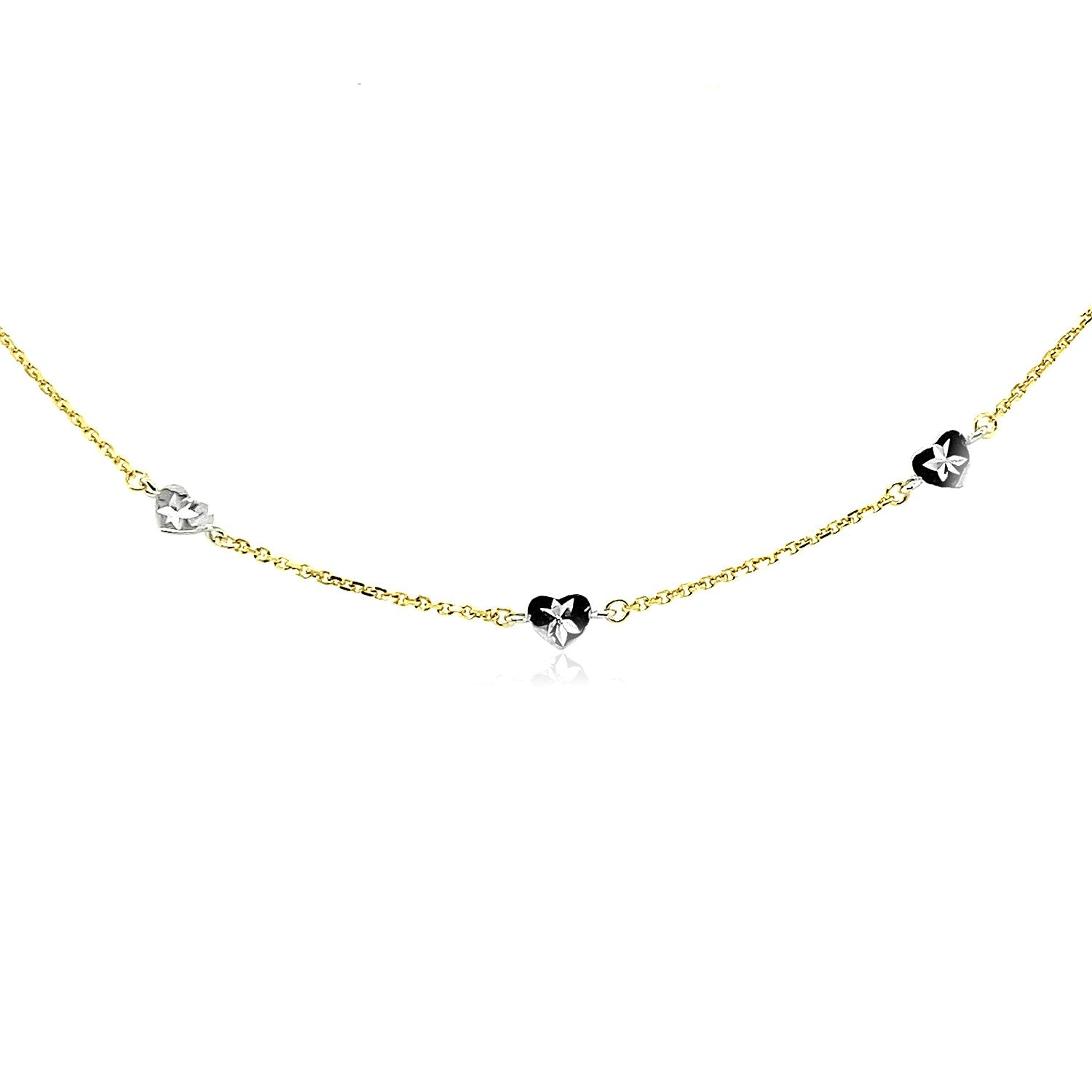 14k two-tone gold anklet featuring diamond cut heart style stations and a minimalist chain design.