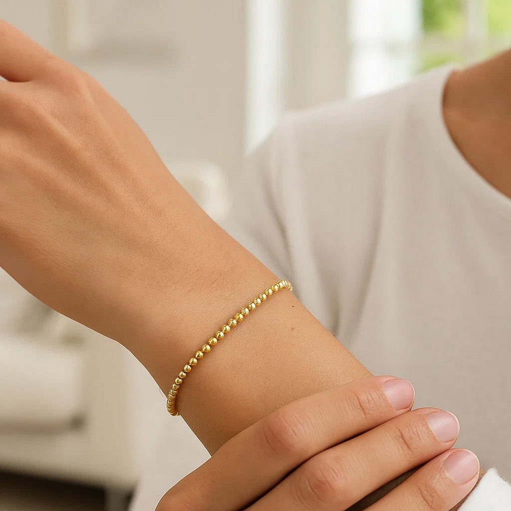Elegant 14K yellow gold bead bracelet featuring refined 3.00 mm beads for a timeless luxury accessory.