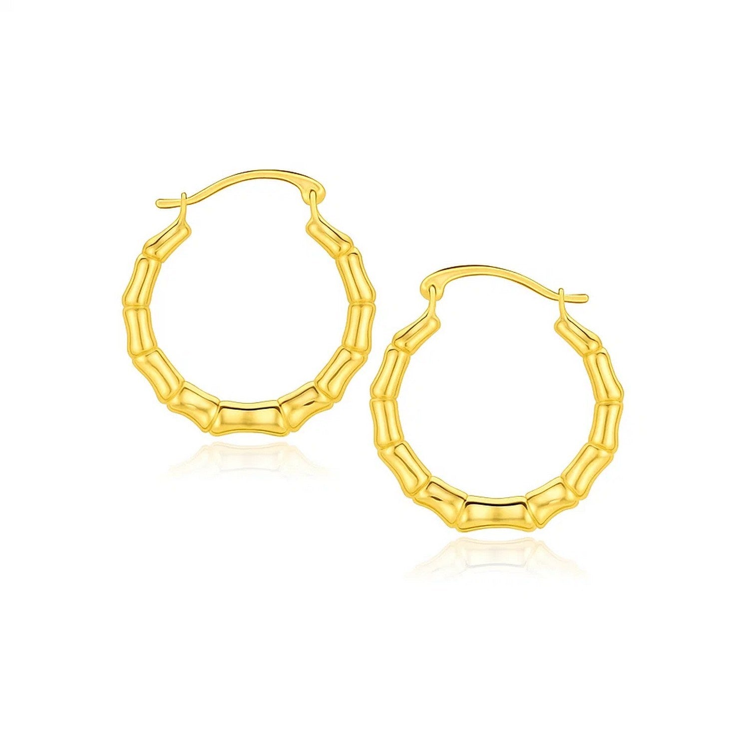 Contemporary 10k yellow gold hoop earrings featuring an elegant branch motif, crafted in luxurious 14k gold.