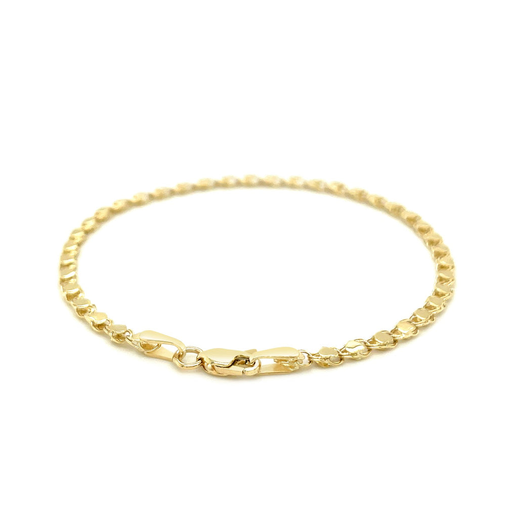 14k yellow gold heart bracelet with modern link design, showcasing elegance and luxury in every detail.