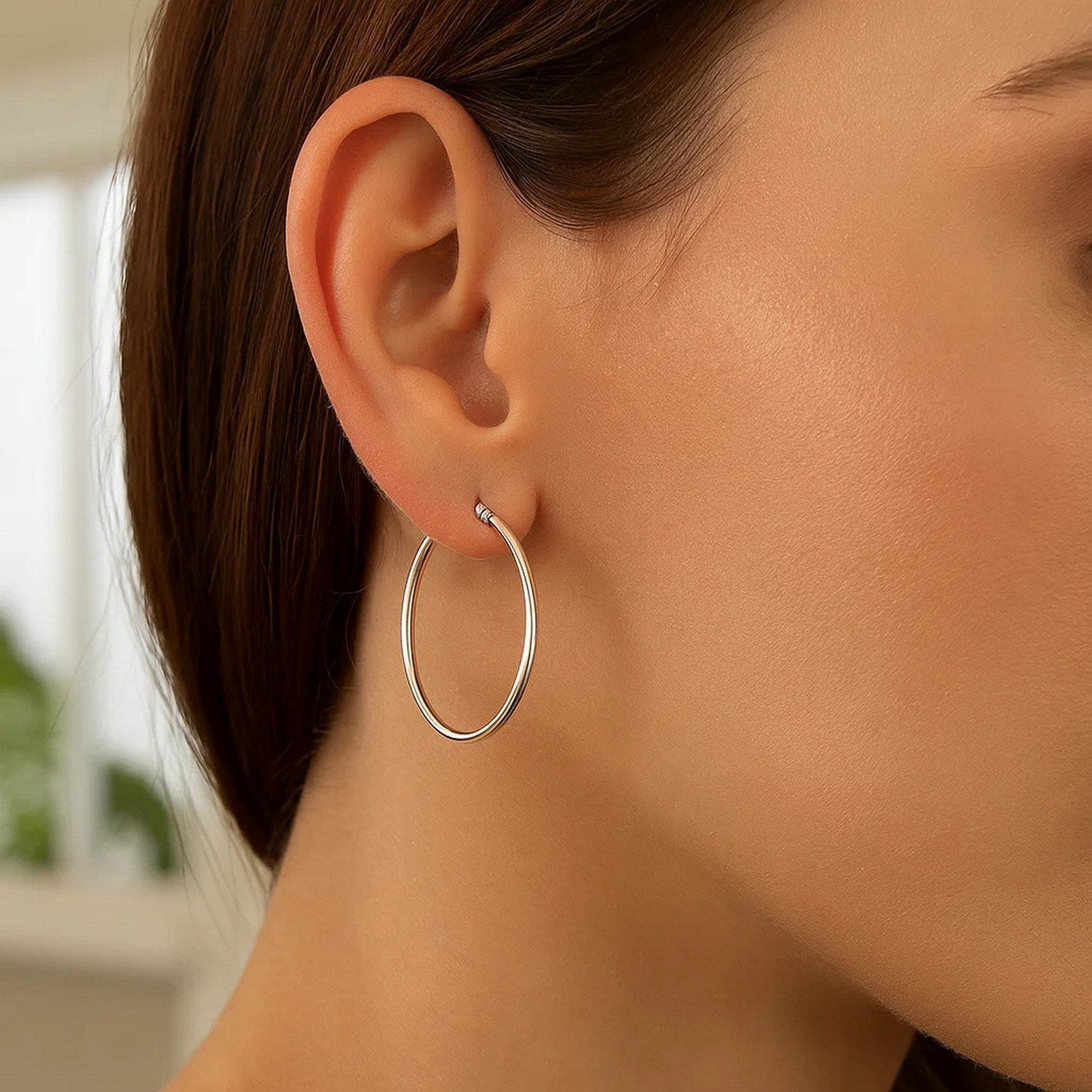 Elegant 14k white gold polished hoop earrings showcasing a sleek, timeless design for sophisticated style.