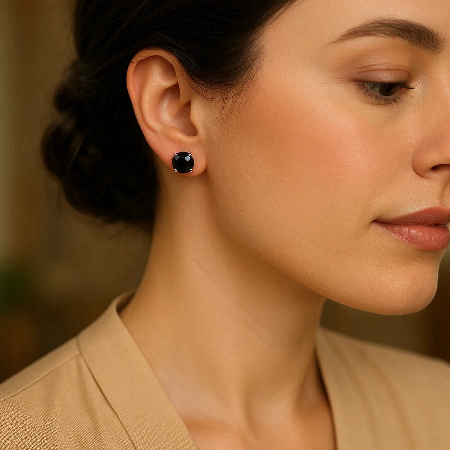 14k white gold faceted black cubic zirconia stud earrings in a contemporary prong setting, showcasing elegant round design.